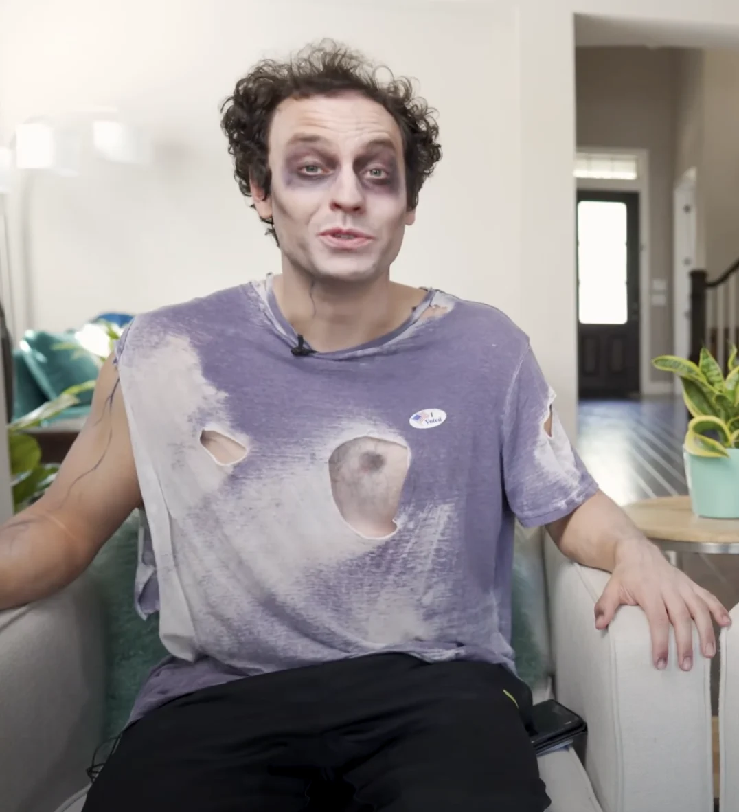 Brent Pella in zombie makeup and a torn T-shirt