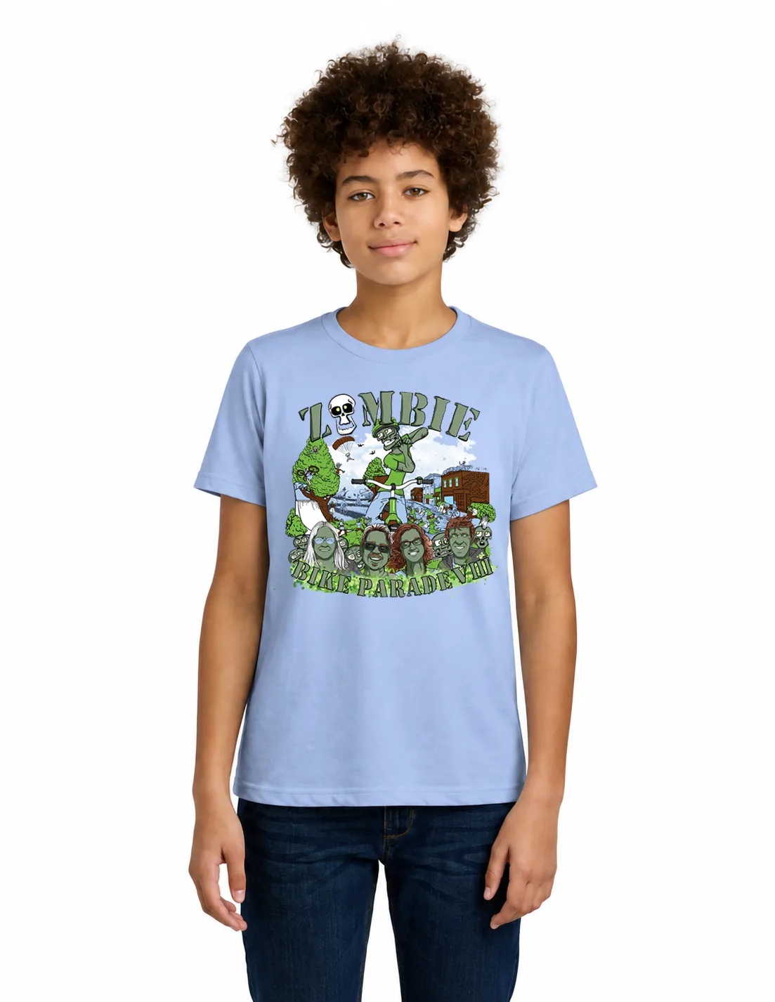 A teenager models the 2026 Zombie Bike Parade VIII t-shirt in light blue, printed with a skydiver, a zombie on a bike scooter and a crowd of team member faces.