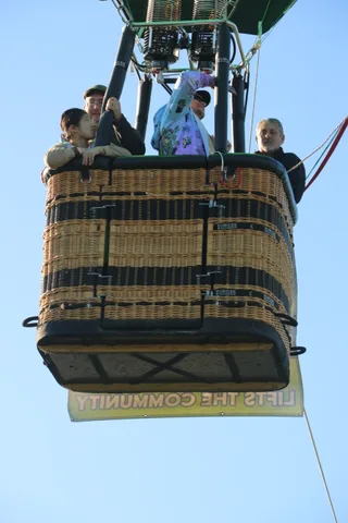 The basket group waits under the burner before launch.