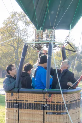 Riders are mostly hidden behind the burner mechanism above them.