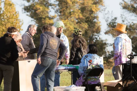 Volunteers set up at a staging table before the event begins.