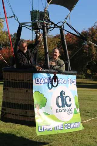 A cropped close view of the Davis Food Co-op logo ring on the basket edge.
