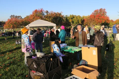 Volunteers set up a registration tent on the cemetery lawn before the event.