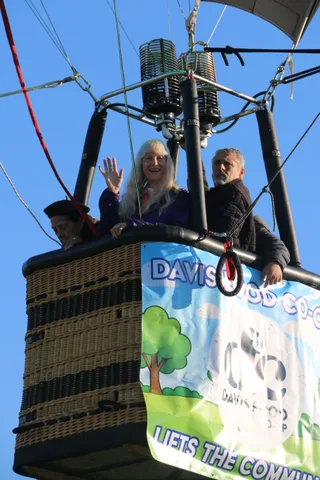 The co-op banner is visible on the basket as it rises.