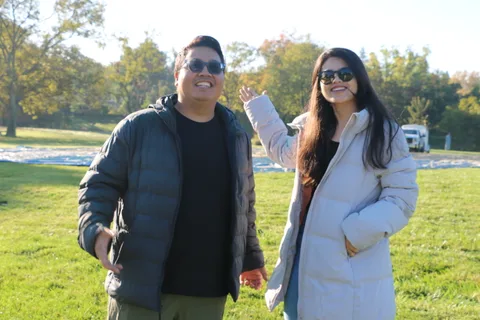 A couple waves and smiles on the grass before the launch.