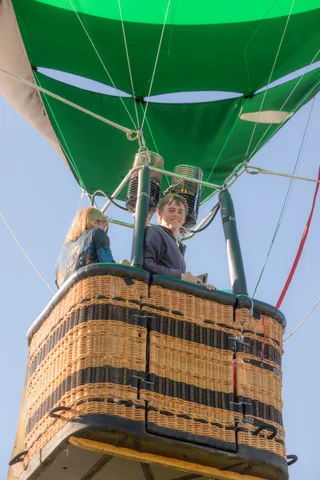 A close, abstract view of the woven texture of a hot air balloon basket.