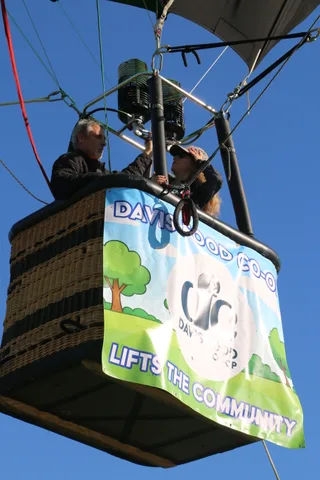 A clean close view of the Davis Food Co-op Lifts the Community sponsor banner.