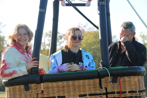 The zombie-costumed rider continues the conversation in the basket.