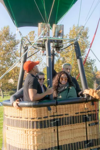 The double burner coils dominate the frame with riders only partly visible below.
