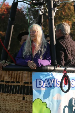 Riders and the co-op banner are visible together on the basket.