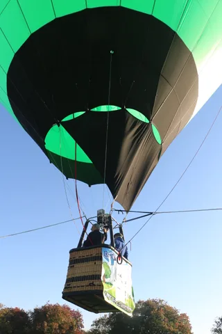 The Davis Food Co-op logo and Lifts the Community slogan are fully readable on the balloon basket.
