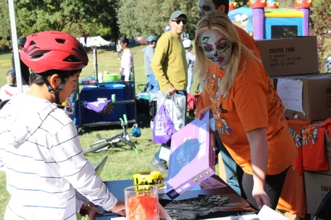 Guests browse a prize table at the festival.