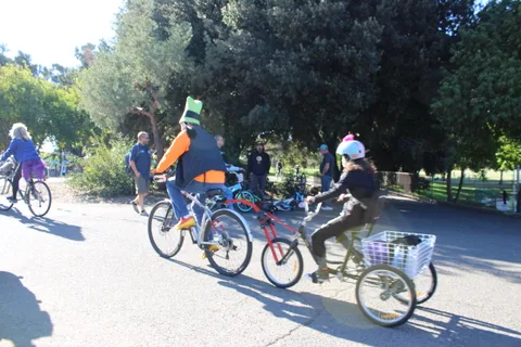 Costumed riders pedal along the path during the zombie bike ride