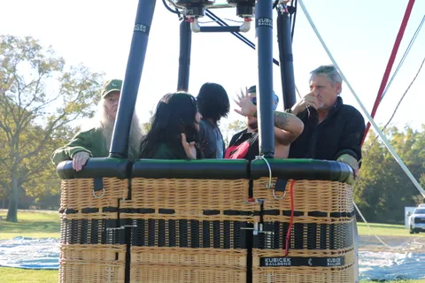 Riders share a quiet moment in the balloon basket.