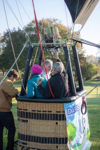 Passengers settle into a balloon basket before lift off