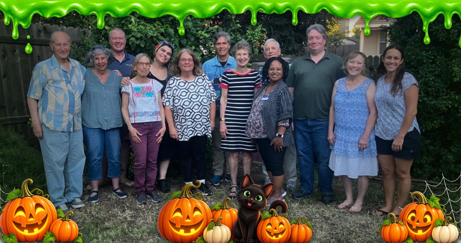 Davis Sunset Rotary members together, with slime, cobwebs, pumpkins and a black cat