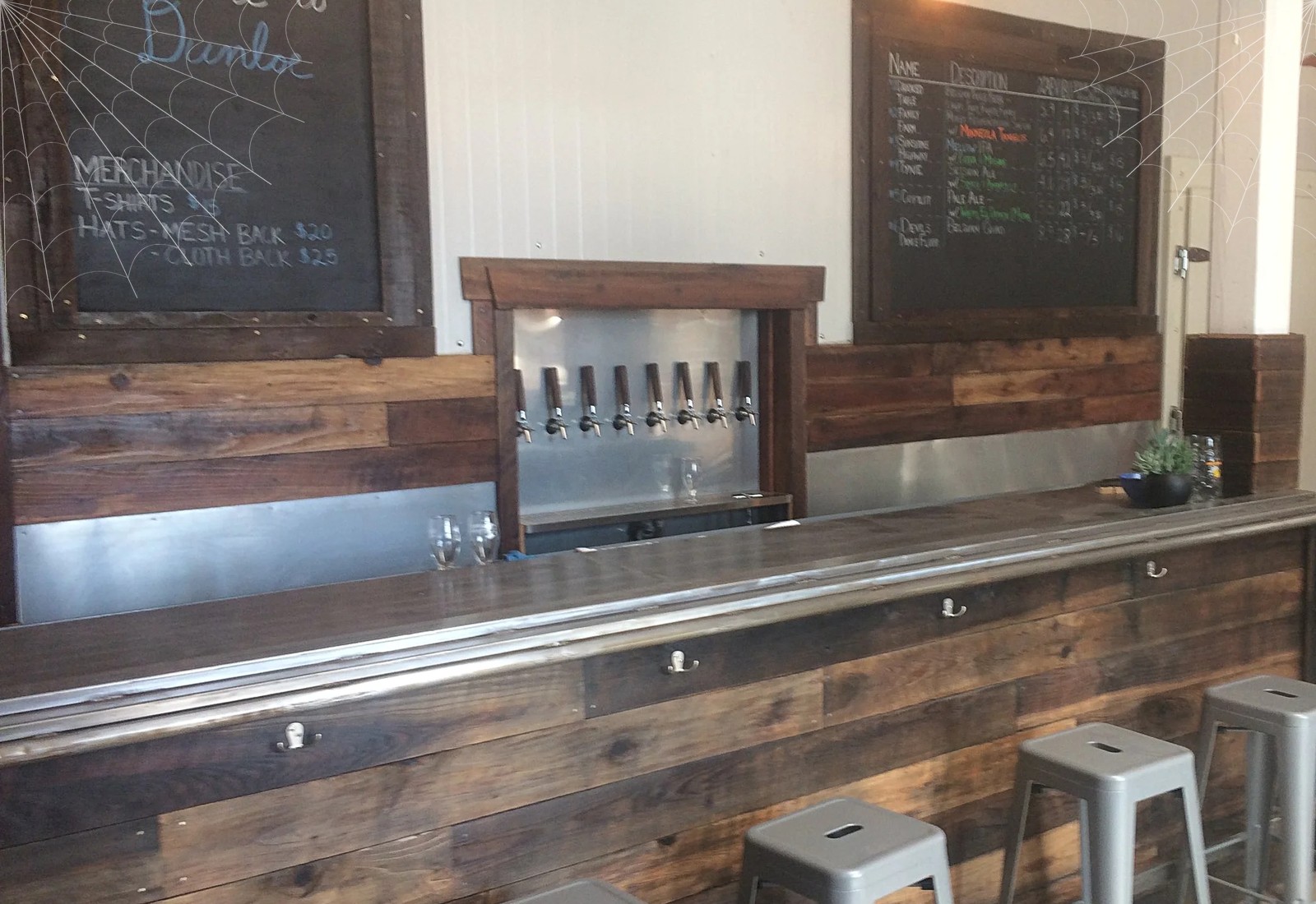 The Dunloe Brewing tasting room bar on Olive Drive, with cobwebs