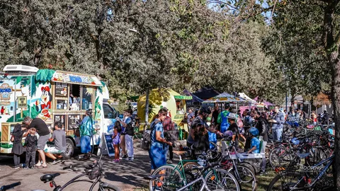 A wide view of the food truck area busy with festival-goers.