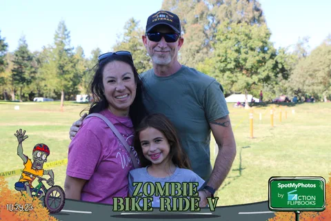 A mother, father and daughter smile together at the festival.