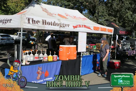 Guests browse the Hotdogger food tent with its playful banner.