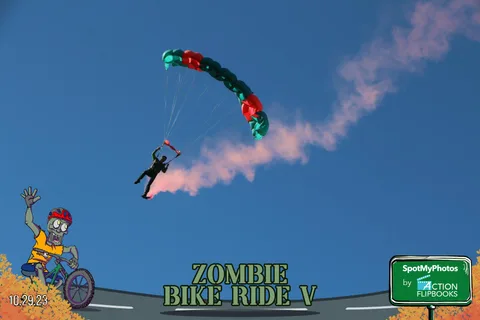 A small parachute is visible high in the sky with a long white smoke trail behind it.