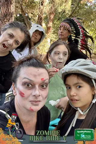 A close selfie-style shot of several people making playful faces at the camera.