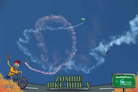 A dramatic white smoke ring fills the sky as two parachutists cross through it.