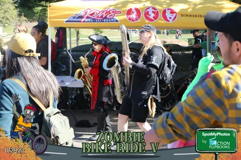 Costumed musicians perform near the Ken's Bike and Ski sponsor tent.