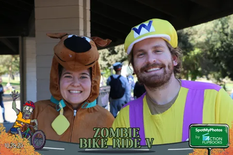 The Scooby-Doo and Shaggy costumed couple pose together again.