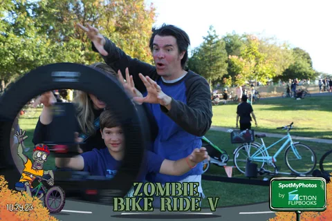A man makes an exaggerated gesture with motion blur next to a boy.