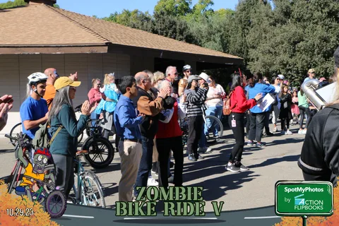 A crowd of cyclists lines up near the gazebo before the ride.