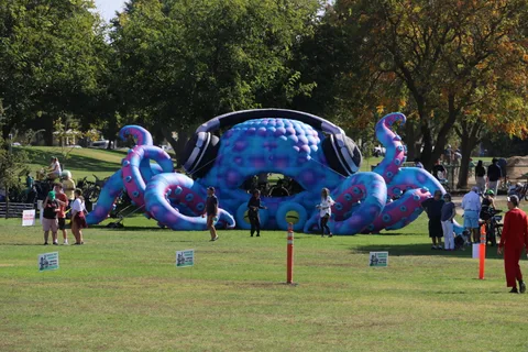 A giant blue octopus inflatable decorates the festival grounds.