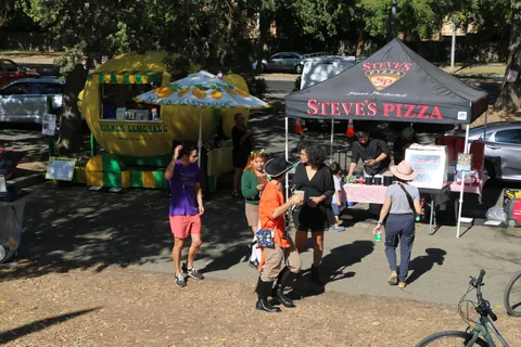 A golden dragon inflatable towers over the Steve's Pizza tent at the festival.