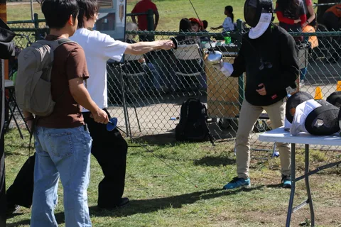 A man practices archery at the festival's target booth.