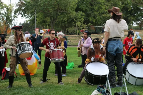 A pirate-costumed drum line performs from a different angle.