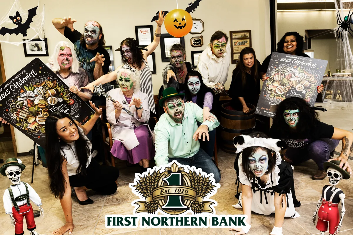 A large costumed office group poses together with a First Northern Bank logo overlay.