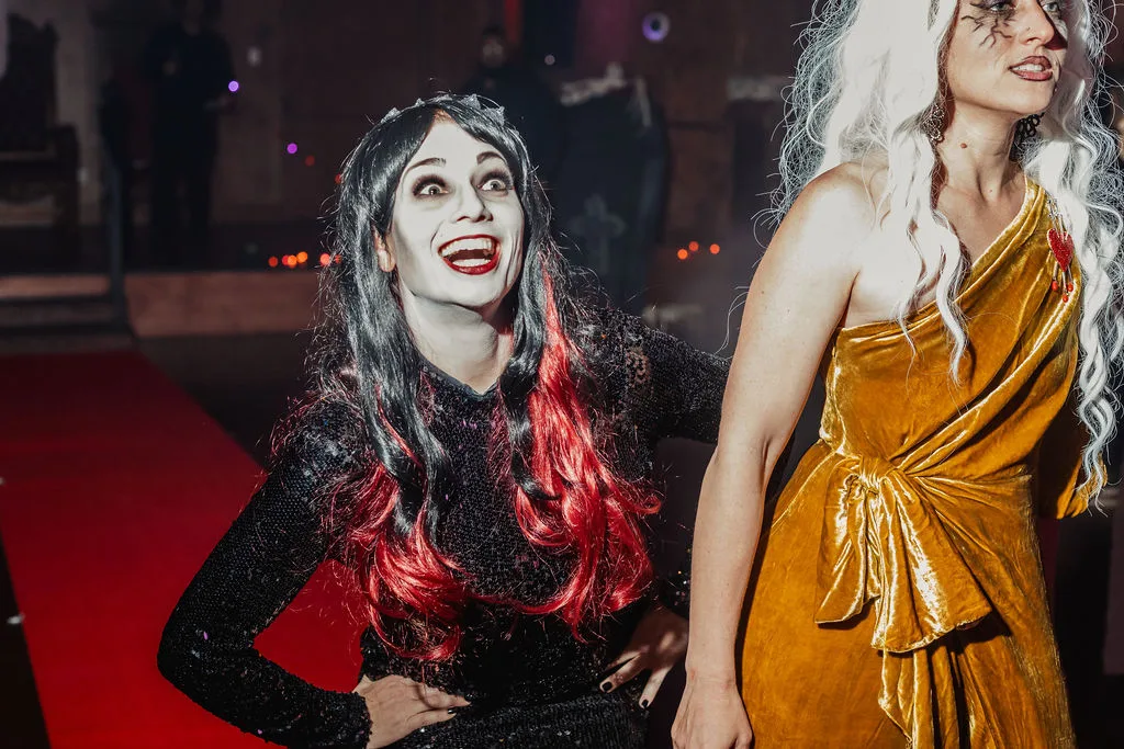 Two guests show off dramatic gothic makeup at the Zombie Ball.