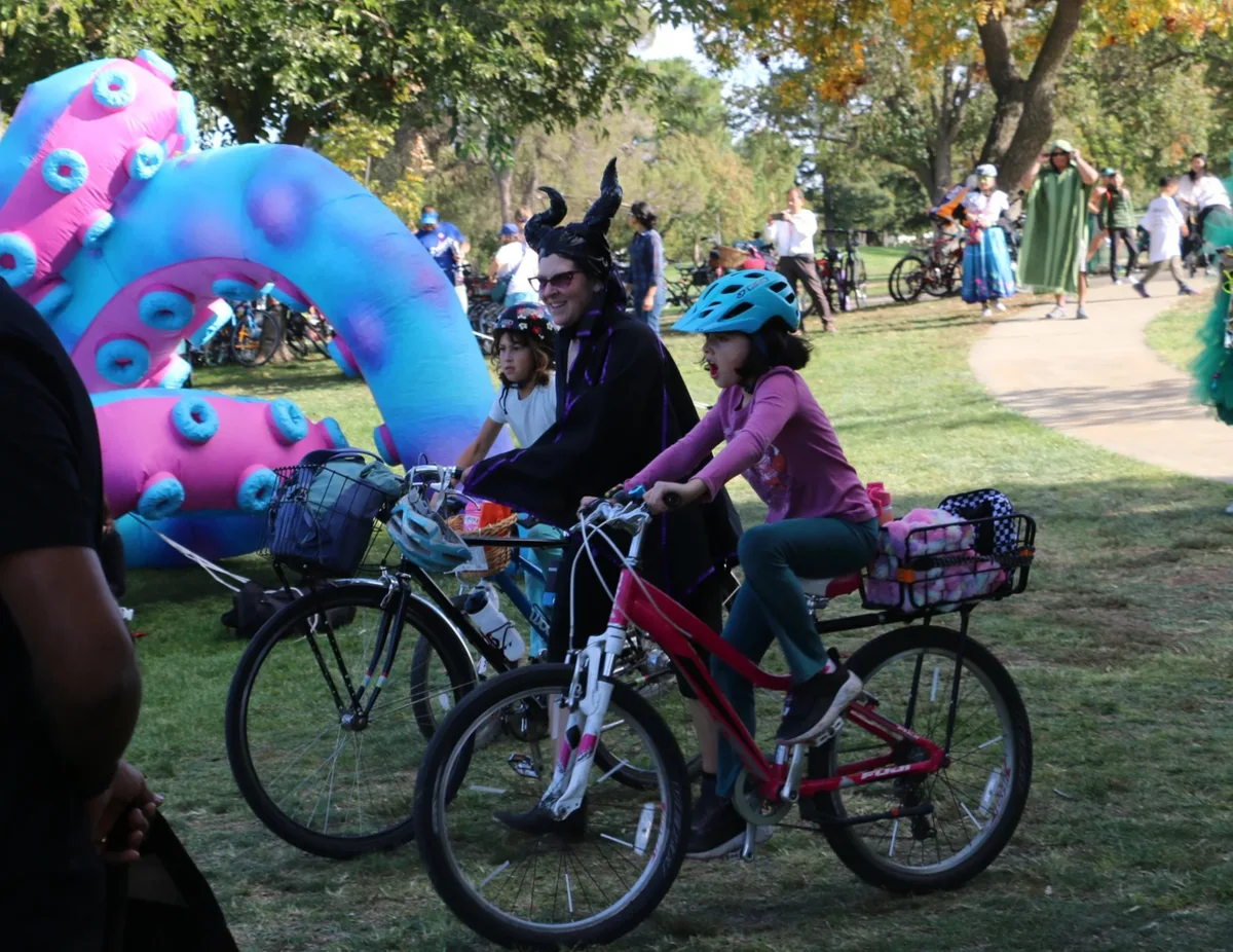 Colorful inflatable balloon-animal sculptures tower over the park path.