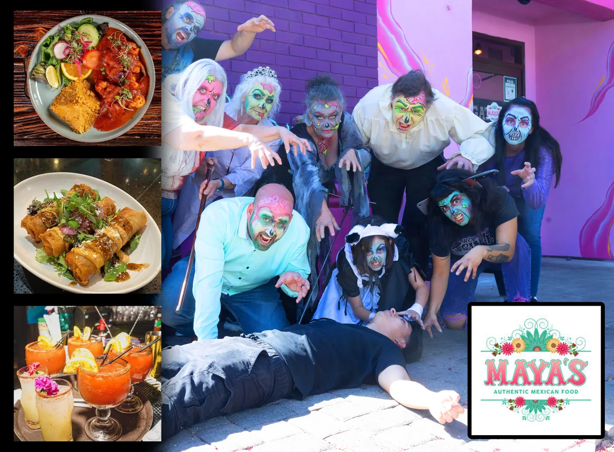A costumed group poses with food at a restaurant with a partly visible banner.